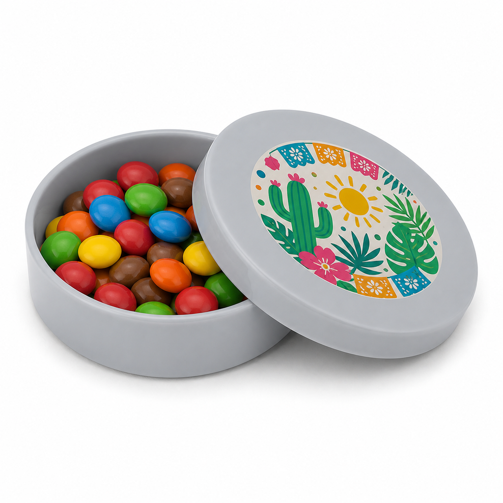 Silver mini plastic favour tin filled with colourful sweets, with a tropical decorated matching lid on a white background