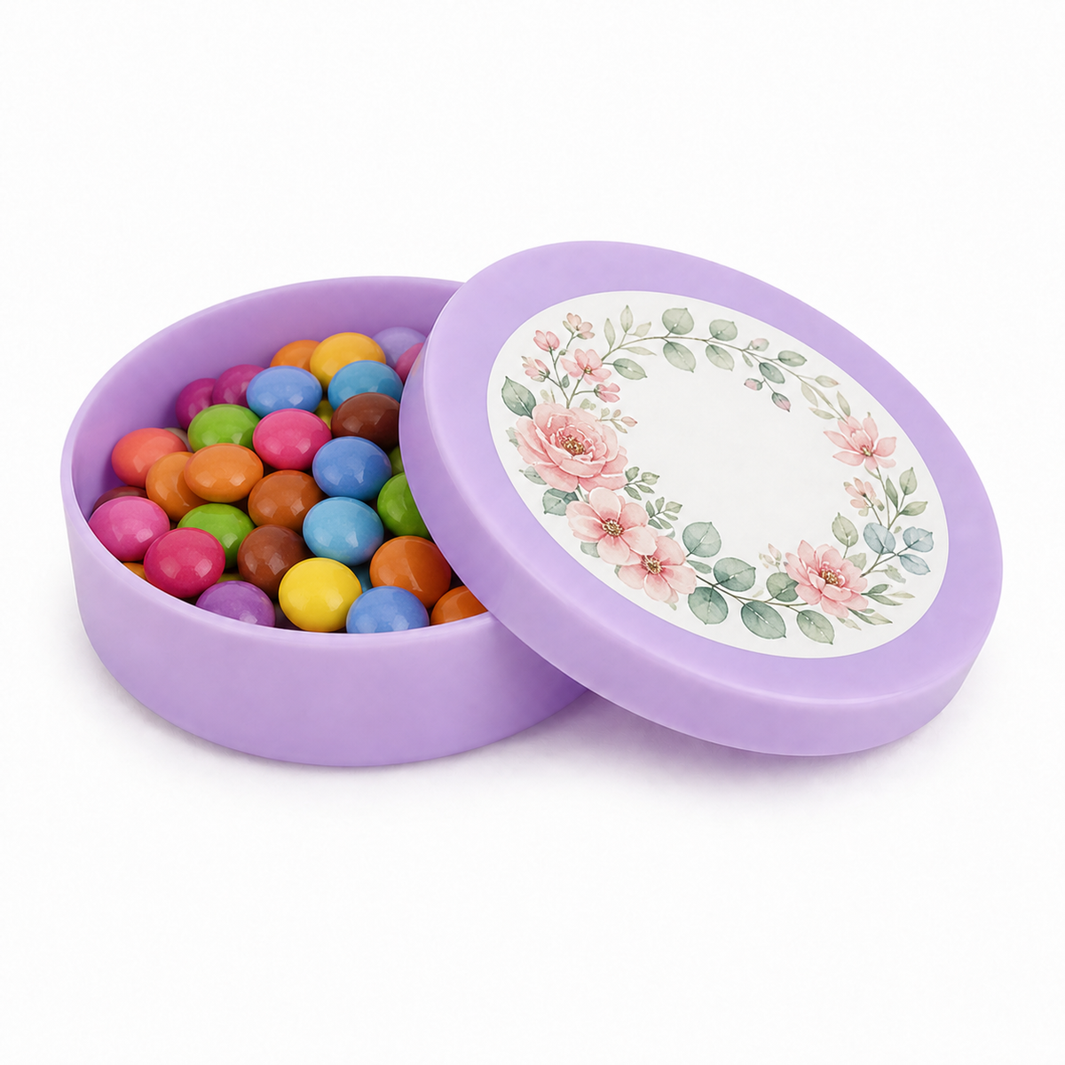 Lilac mini plastic favour tin filled with colourful sweets, with a floral decorated matching lid on a white background
