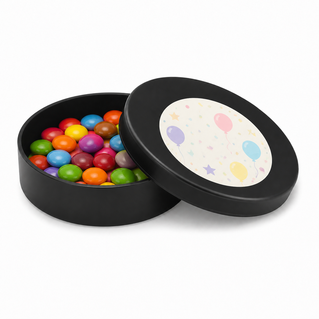 Black mini plastic favour tin filled with colourful sweets, with a decorated matching lid on a white background